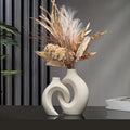 Ensemble de vases en céramique creux modernes avec design artistique sculptural blanc mat pour l'intérieur